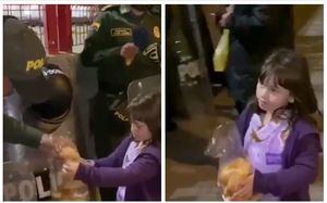 (Video) Niña conmueve al darles pan a los miembros de la Policía en medio del cacerolazo