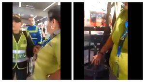 (VIDEO) Policías esposan funcionaria de TransMilenio porque no los dejó colar