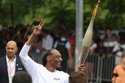 Snoop Dogg danced, greeted everyone, and had a great time while carrying the Olympic torch